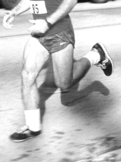 A runner in motion, photographed in black and white
